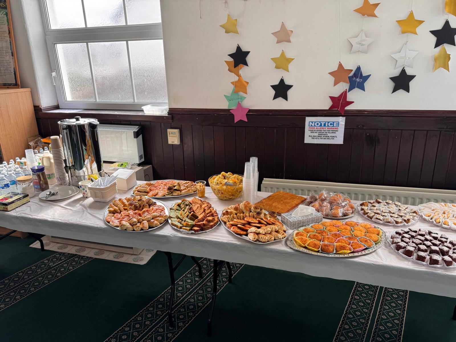 A table of sweets and treats shared at Canolfan Iman Centre during Ramadan